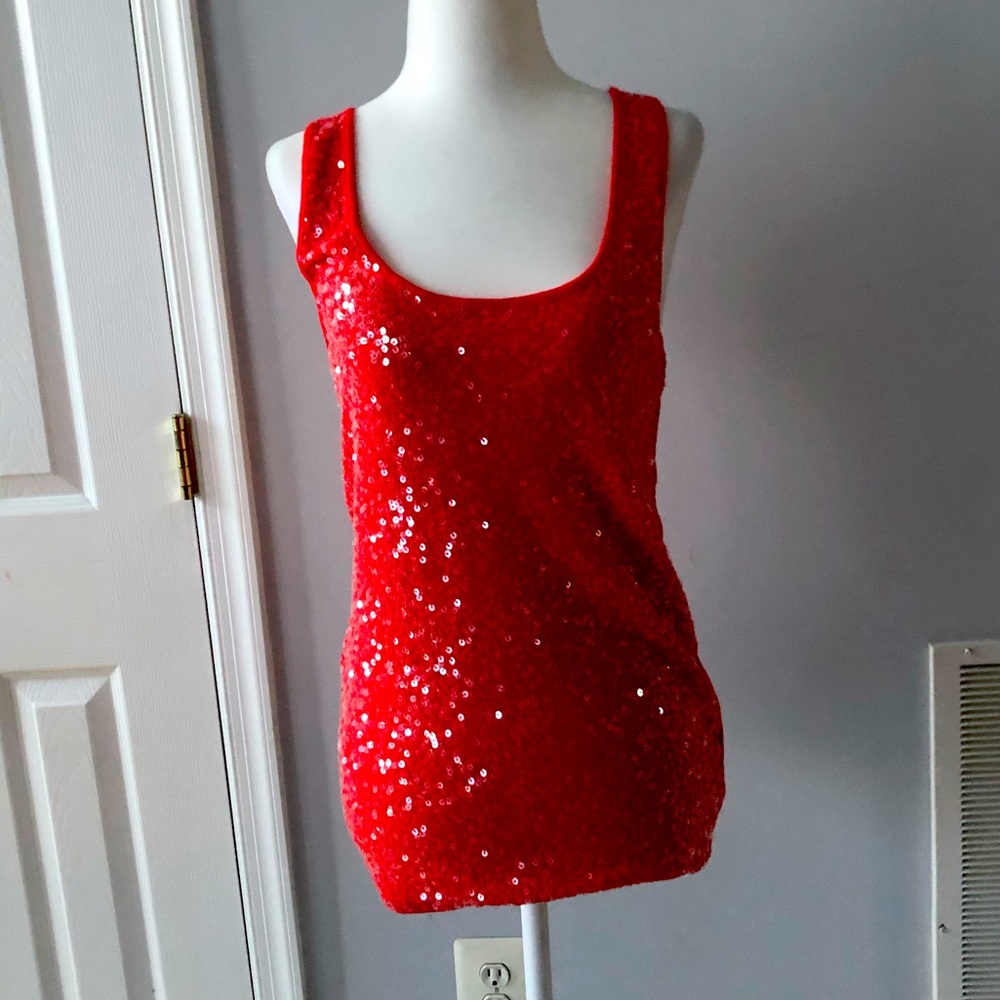 Old navy red glittery tank top. Check the last pic for flaw. Size LG